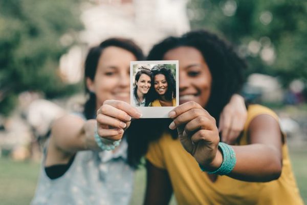 girls taking selfie 