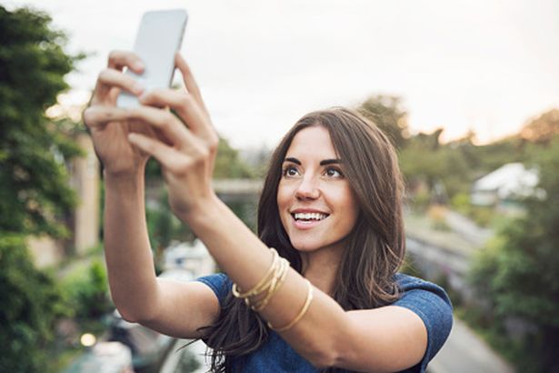 girl taking selfie 