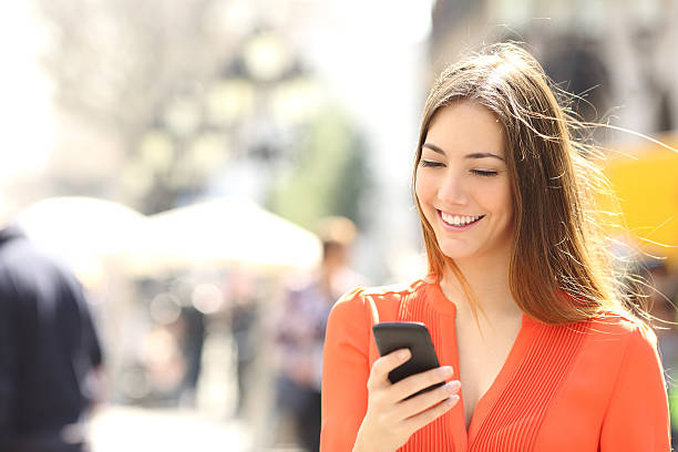 image of girl having phone in her hand 